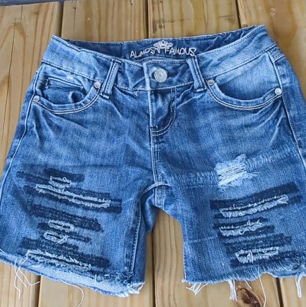 💙Almost Famous Jean Shorts with the Distressed Torn Look size 1